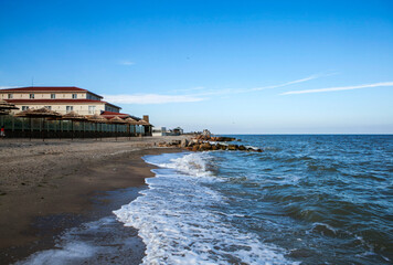 Sandy beach and hotel "Sun Resort" on the first line of the Berdyansk Spit on the coast of the Sea of ​​Azov. Berdyansk. Zaporizhia region