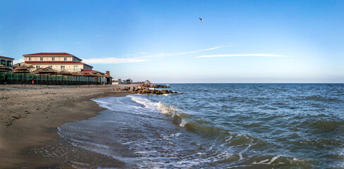 Sandy beach and hotel "Sun Resort" on the first line of the Berdyansk Spit on the coast of the Sea of ​​Azov. Berdyansk. Zaporizhia region