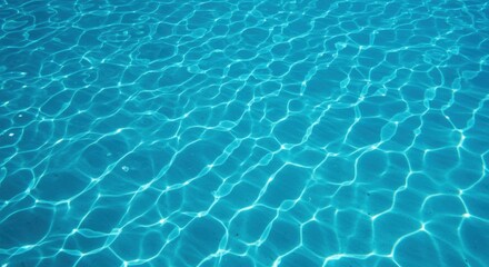 Obraz premium Underwater view with crystal clear turquoise water and sunlight rays penetrating surface. Swimming pool bottom with rippling light patterns. Summer vacation and aquatic concept