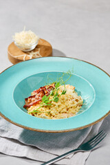 Elegant Gourmet Presentation of Ptitim with Bacon a la Carbonara in Pastel Tones