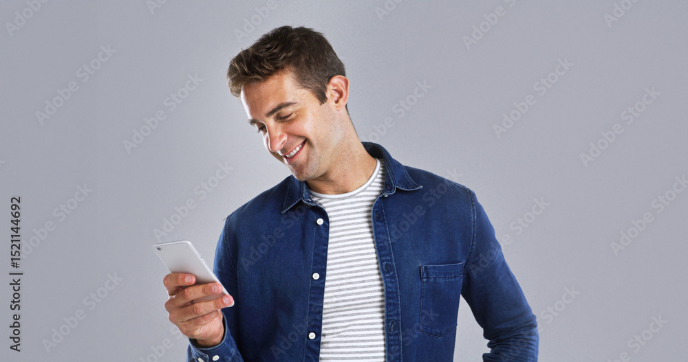 Poster smile, phone and man in studio for social media, text or reading message on white background space. 