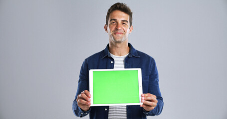 Tablet, man for green screen and mockup in portrait in studio, UI advertising or website ads for...