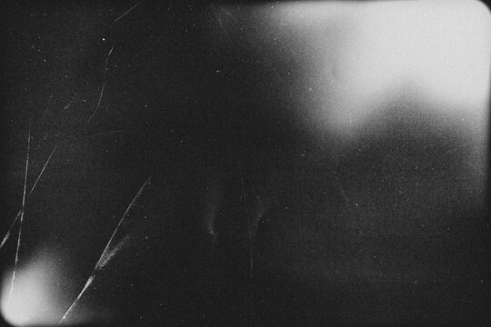 light leak overlay effect with scratch dust and light leaks,retro grain noisy film distressed texture light leak flare on black background,retro film overlay