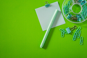 Top view of educational elements arranged on a smooth, bright background.