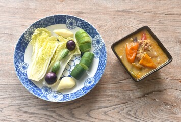 herb soya bean sauce with mashed pork dipping fresh vegetable on plate