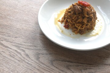 stir fried spicy chicken with chop ginger and chili Thai food on plate