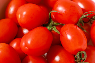 take a close-up shot of a red-ripe cherry tomato
