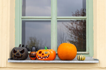 Halloween pumpkins and lanterns decorating a window sill in Banska Stiavnica, Slovakia