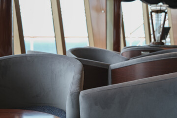 Cozy living room atmosphere inside cafe café coffee shop bar lounge bistro onboard luxury cruiseship cruise ship liner in contemporary Art Deco interior design