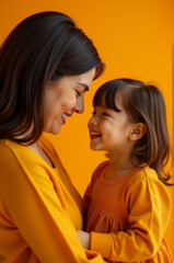 A mother holds her young daughter close, offering comfort and love