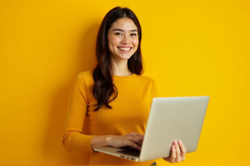 A woman sits with her laptop open, possibly working or browsing