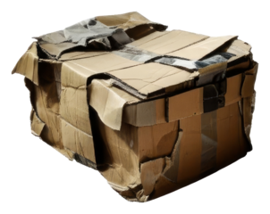 PNG crumpled cardboard box rests on a white surface.
