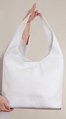 young woman holding a bag