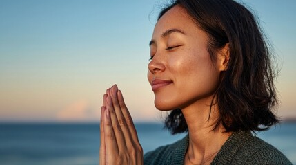 "A woman kneeling in a serene setting with a spiritual or meditative atmosphere."