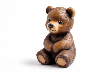 A charming brown teddy bear figurine sitting upright with a white background in a studio setting indoors