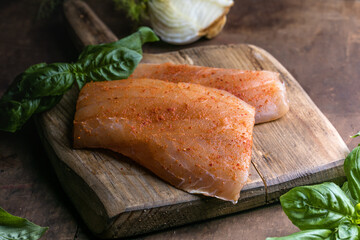 Red snapper fish fillet on wooden background