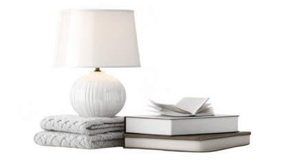 Cozy nightstand setting featuring a stack of books with an open book on top, soft towels, and a modern lamp, all against a transparent background