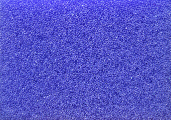 Purple porous cleaning sponge texture or background