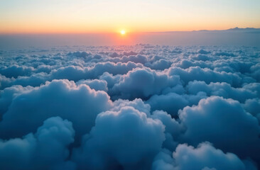 blue fluffy clouds in the light of the sunset. natural landscape from a height of flight