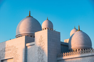 dome of the Grand mosque Abu Dhabi, Islamic architecture mosque at sunset, golden light on mosque,...