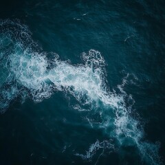 Fototapeta premium A serene aerial view depicting turbulent ocean water patterns