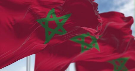 Morocco national flags waving in the wind on a clear day