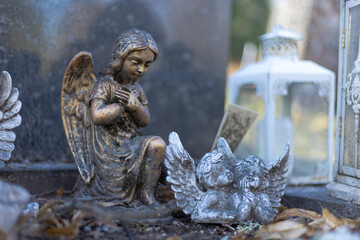 A peaceful Lutheric cemetery in Finland, featuring a solitary grave marked by a stone angel. The...