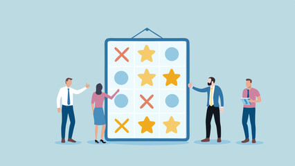 Fototapeta premium People standing around a board with tic tac toe symbols of crosses circles and stars displayed on it