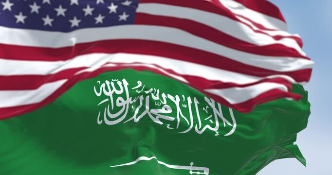 Saudi Arabian and American flags waving together in sky, 3D render