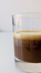 Fresh Espresso Coffee with Rich Crema in a Glass Cup