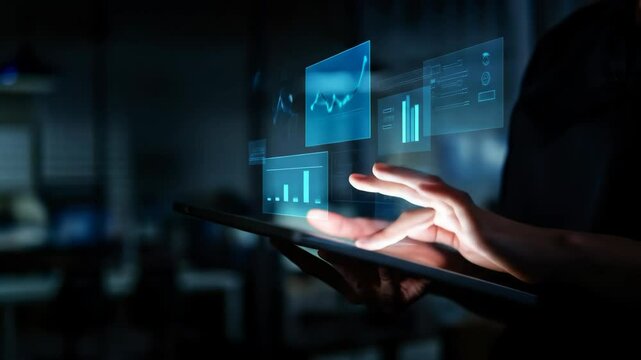 Business analytics data report on a tablet with futuristic chart and graph hologram. Financial technology and business intelligence (BI) concept. 4K video animation.