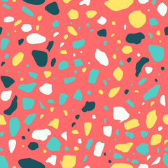 A vibrant abstract pattern featuring variously shaped colorful speckles in teal, yellow, white, and black on a coral background.