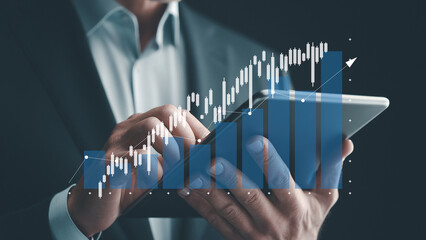 Businessman using tablet trading forex stock market. Business financial data.