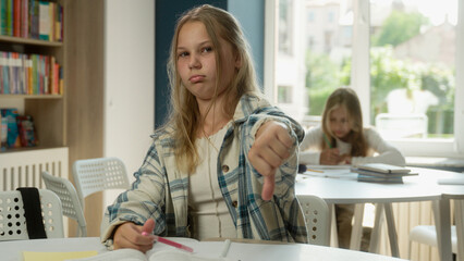 Caucasian girl sad offended teenager pupil student schoolgirl daughter child kid primary education...