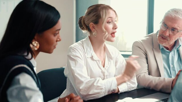 Laptop, meeting and talk with business people in office for sales projection, stakeholder and report. Treasurer budget, digital review and revenue planning with employees in agency for feedback