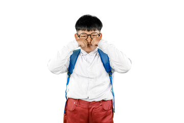 Sad Indian Schoolboy Rubbing Eyes in Uniform with Backpack on White Background
