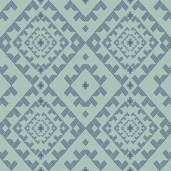 Fototapeta premium This fabric features a blue-green diamond batik pattern with simple yet orderly geometric motifs, suitable for textile designs seeking a calm and modern aesthetic.