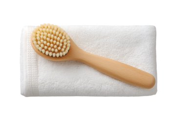 Wooden body brush on a white towel spa bath hygiene wellness