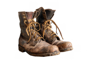 Old, worn, and muddy leather work boots with laces, showing signs of heavy use, are isolated on a transparent background, ready for compositing into various projects