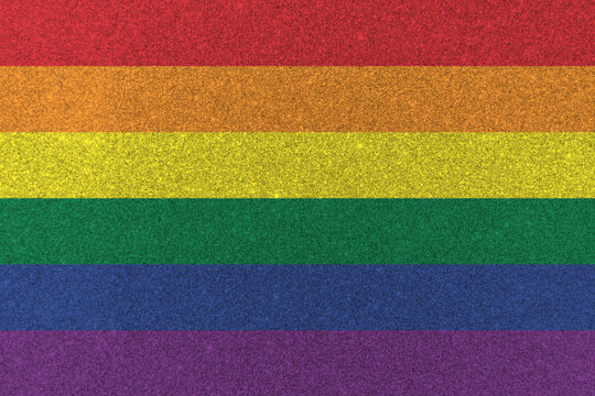 Rainbow flag background on sparking glitter for LGBT, LGBTQ+, LGBTQIA+, Gay pride month, lesbian, bisexual, and transgender people human rights social equality movements in June