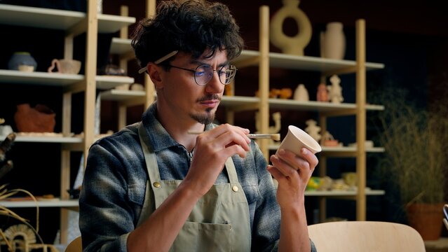 Artist man guy sculptor painter Caucasian male art designer potter decorator painting ornament clay ceramics handmade paint crockery design artwork hobby drawing aquarelle pottery workshop craft hobby