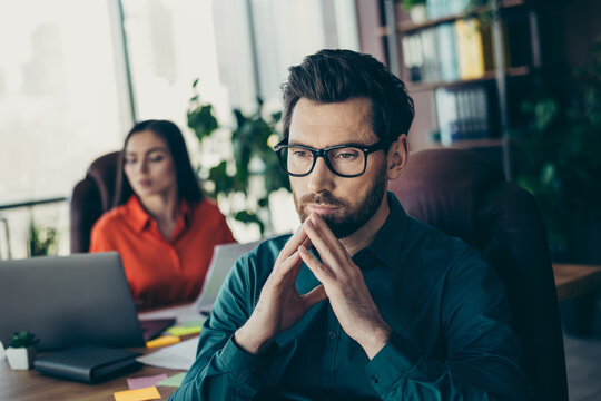 Professional businesspeople collaborating in a modern office, reflecting teamwork and cooperation for corporate success