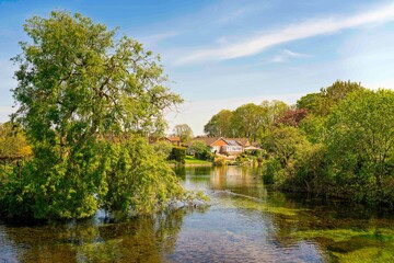 View of the mere, lake, at sunset in Nafferton, Yorkshire, UK.