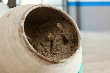 Cement mixer preparing concrete on construction site
