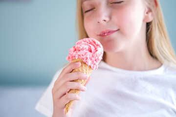 Teen eats strawberry ice cream