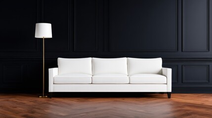 Modern white couch in a stylish dark room with wooden flooring and a sleek lamp beside it