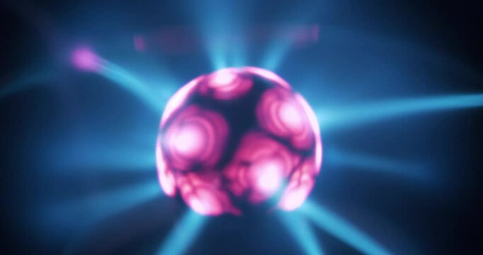Plasma globe with noble gas inside with filaments extending from inner sphere to outer. Flashing reaction to loud noise. Electromagnetic interactions are responsible for glowing filaments