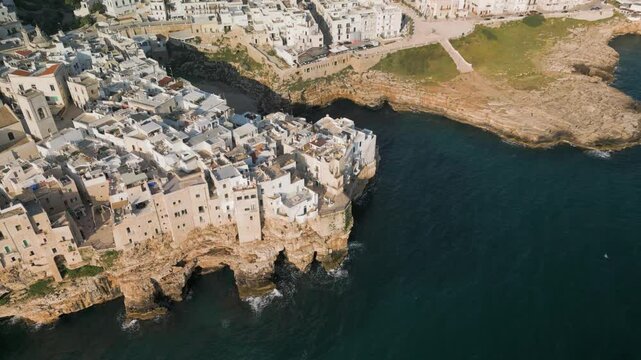 Aerial view of Polignano a Mare, panorama of the Lama Monachile beach, waterfront and the buildings of the old town, Puglia, Italy