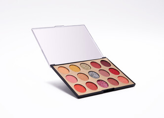 Eyeshadow palette with various warm, neutral and shimmery shades, perfect for versatile makeup looks