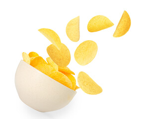 Tasty crispy potato chips falling into bowl on white background